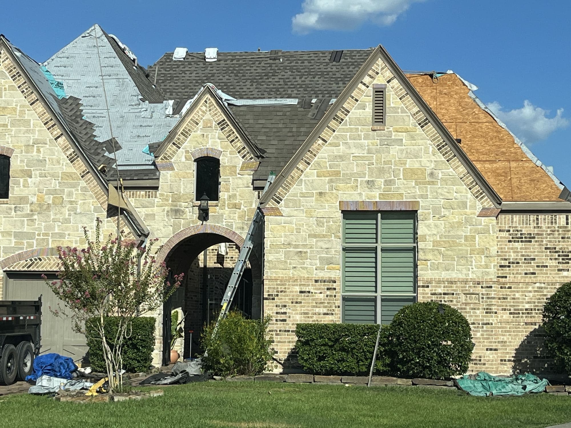True Line crew replacing the roof on a stone home in the Houston area